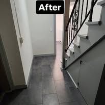 Narrow hallway with dark tile floor and staircase, labeled “After” above.