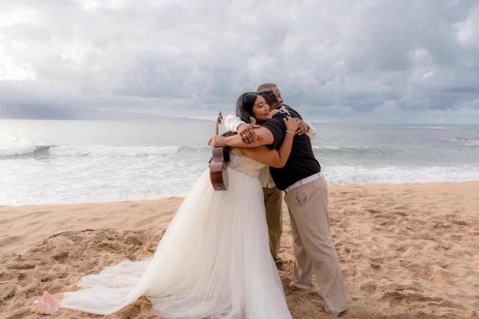 people hugging on beach