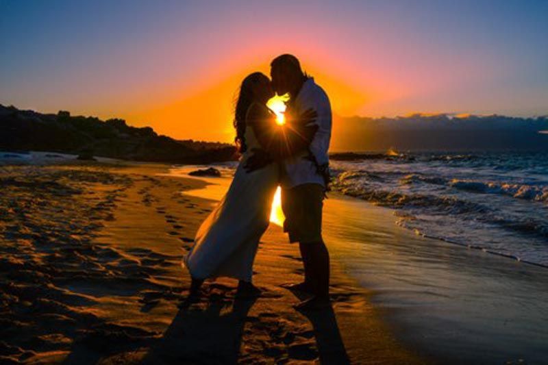 couple on beach at sunset