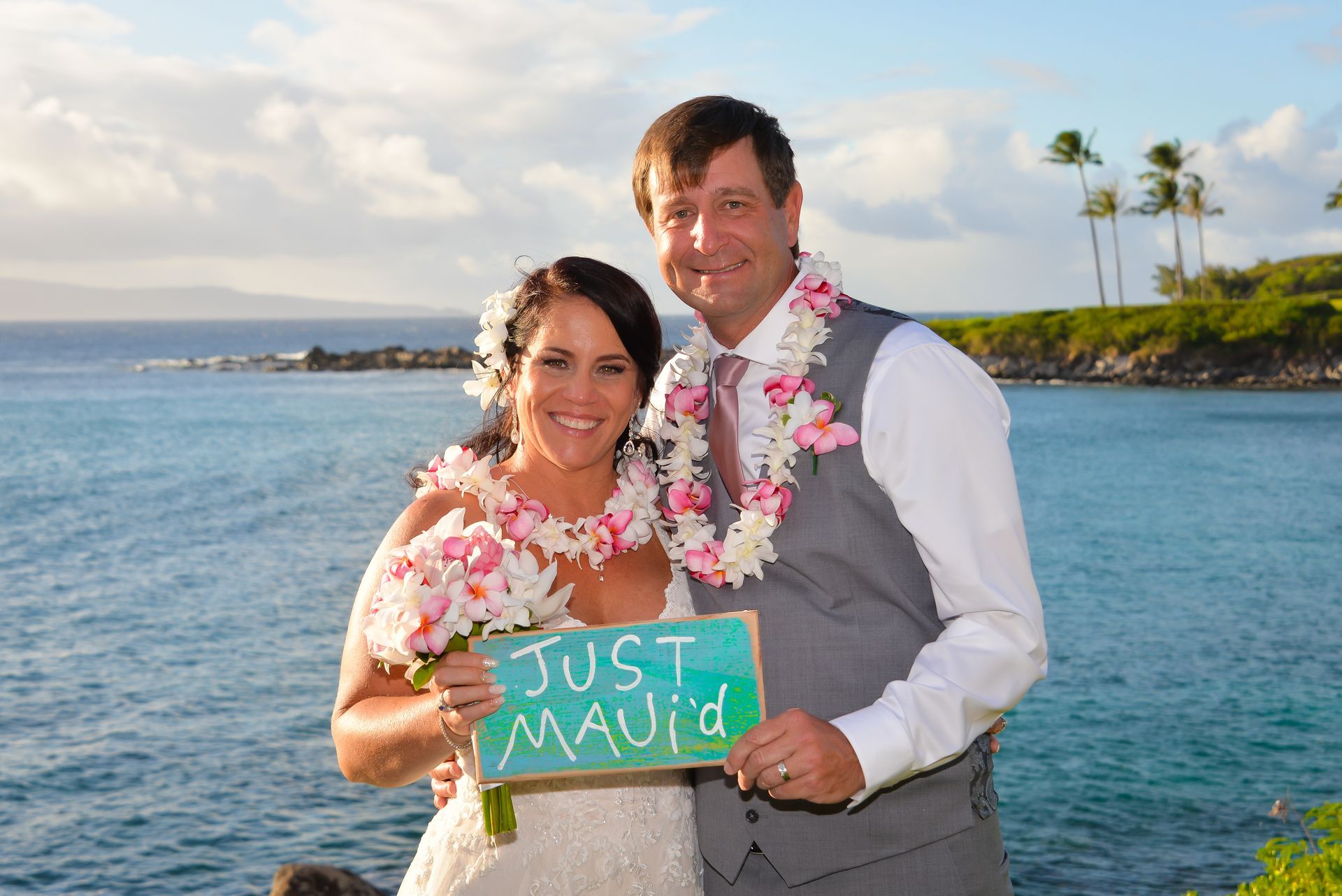 Newlyweds pose with a