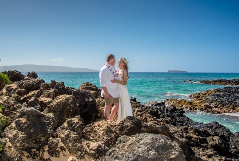 couple on rocks at beach