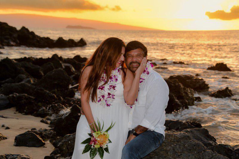 happy couple on beach at sunset