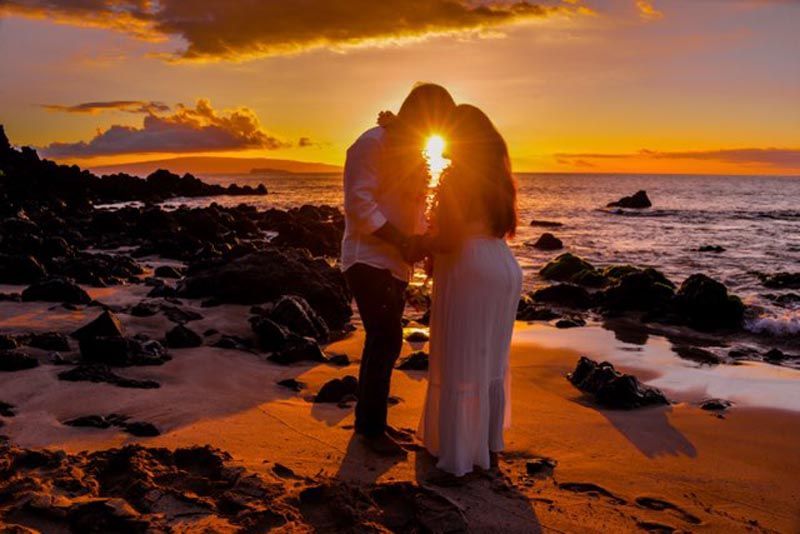 couple on beach during sunset
