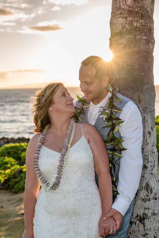 couple on beach near tree