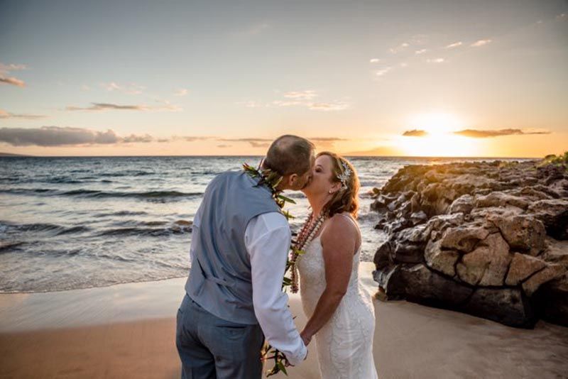 happy couple overlooking beach