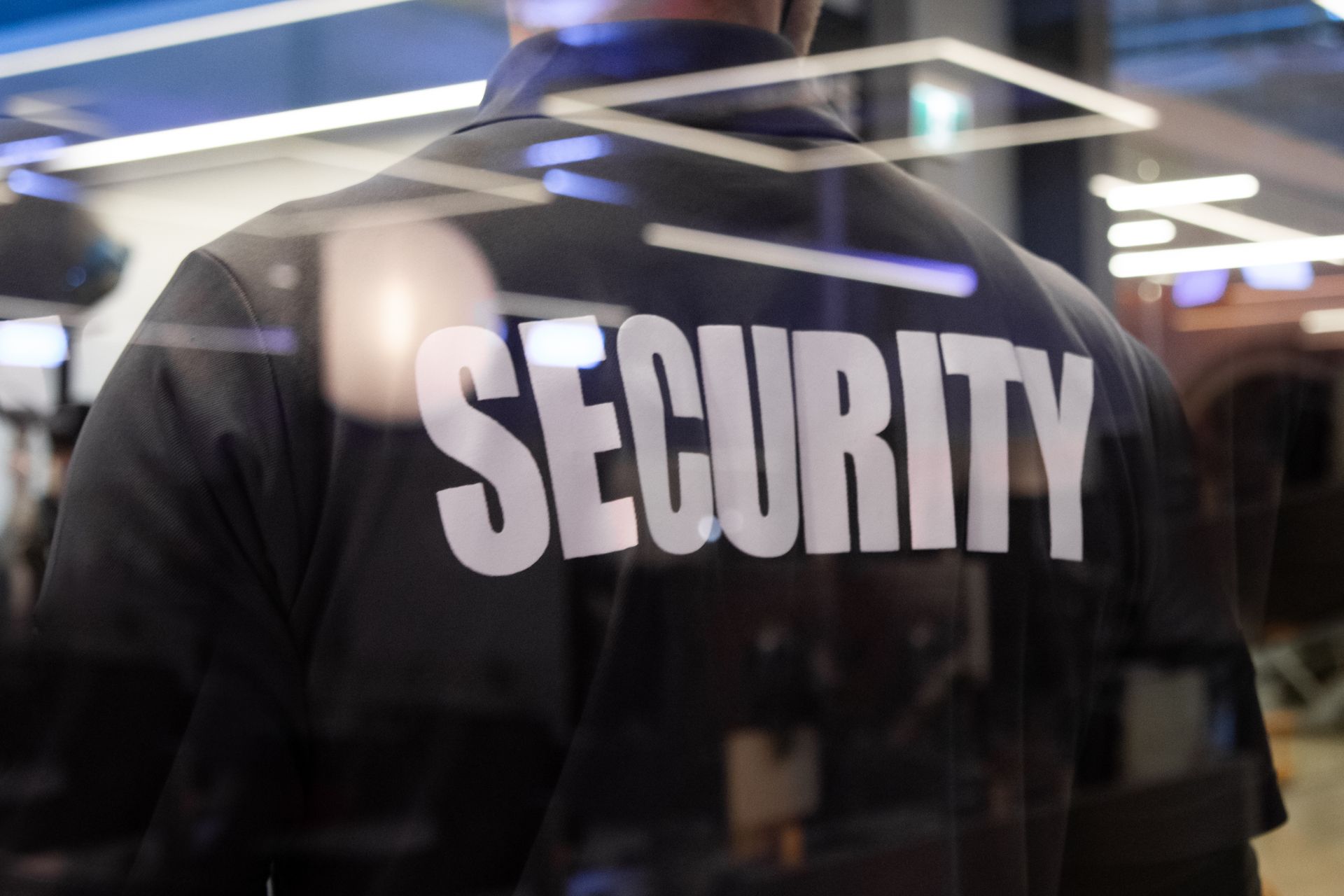 Security guard in black uniform with 