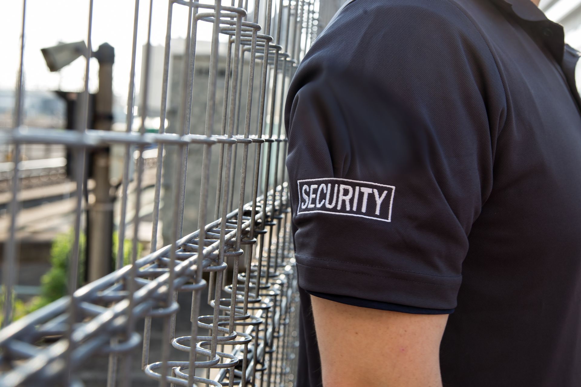 Security guard in black polo shirt with 