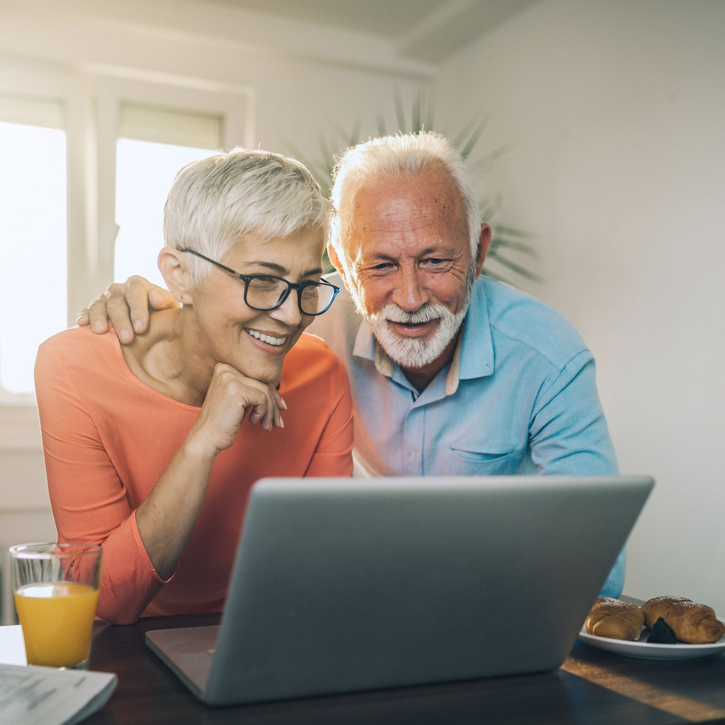 Senior Couple Checking the Laptop — Brooklyn, NY — Tradition Homecare Senior Couple Checking the Laptop — Brooklyn, NY — Tradition Homecare