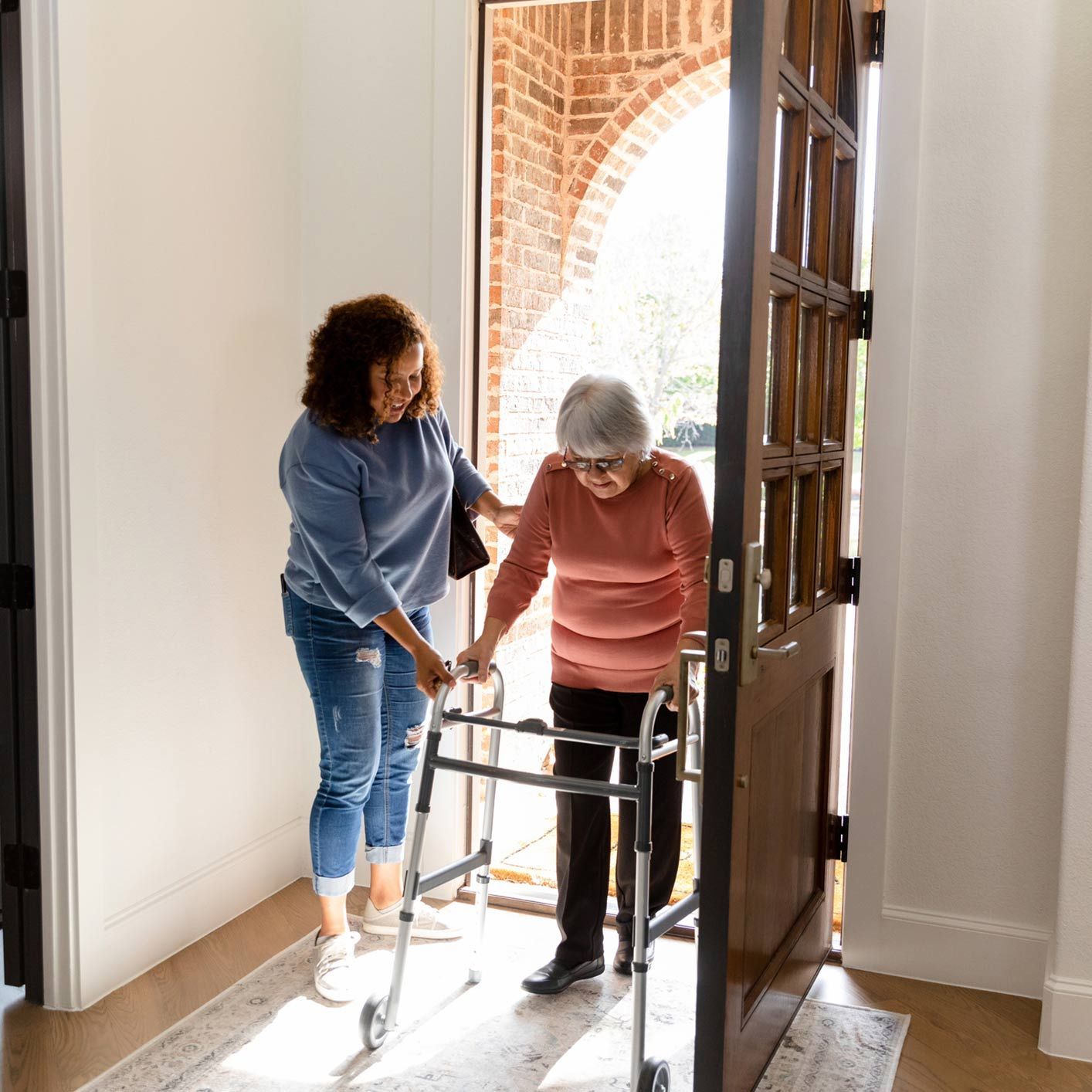Mid Adult Woman Helps Her Senior Adult Friend — Brooklyn, NY — Tradition Homecare Mid Adult Woman Helps Her Senior Adult Friend — Brooklyn, NY — Tradition Homecare