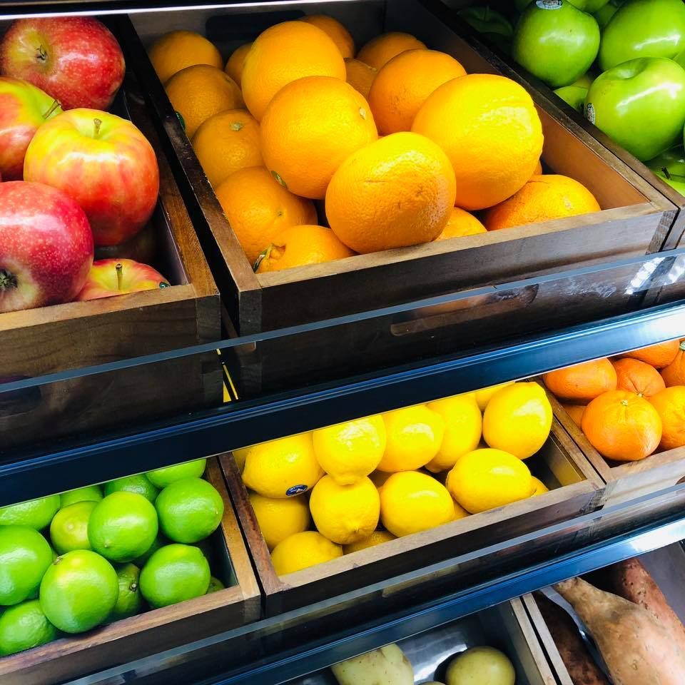 A display of fruit including apples oranges lemons and limes — Smith Street Supermarket In Darwin City, NT