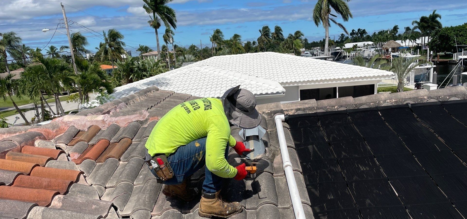 Nast Roofing professional inspecting a tile roof in Pompano Beach FL