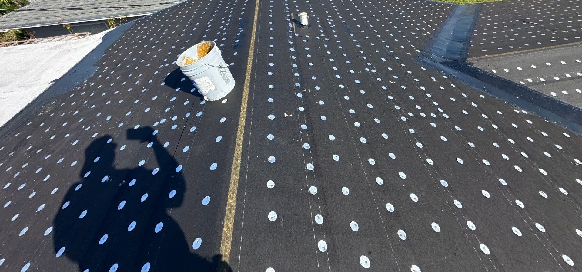 New underlayment installation during roof replacement in Pompano Beach FL