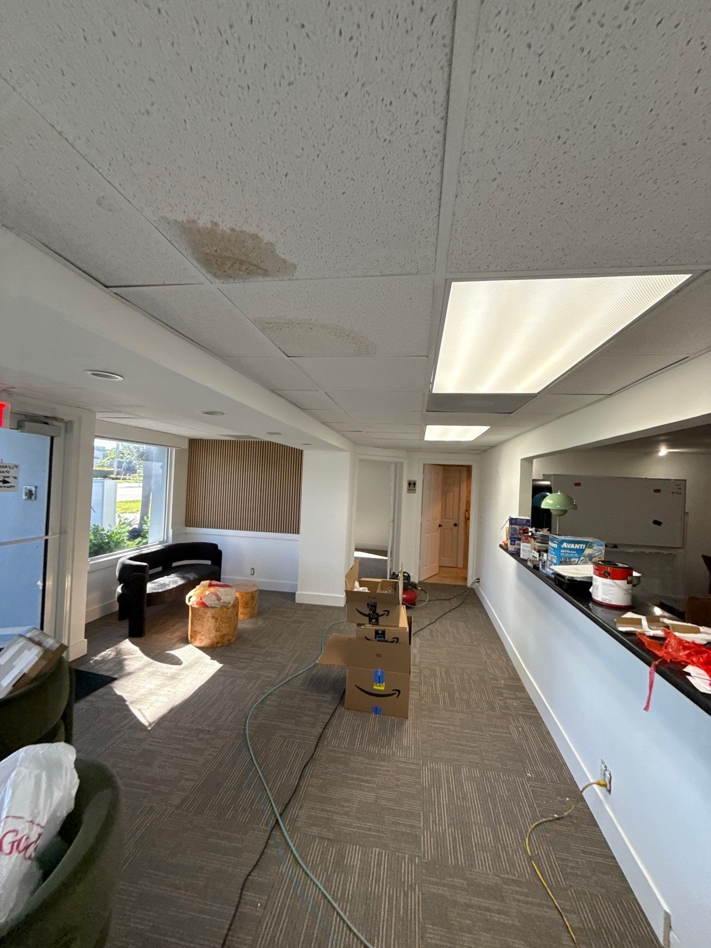 Office interior showing water damage on ceiling due to flat roof leaks
