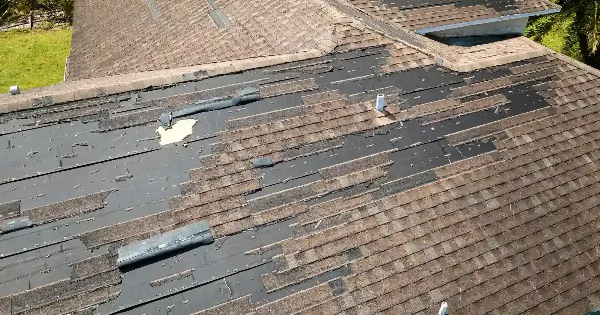A roof of a house in need of storm damage repair services