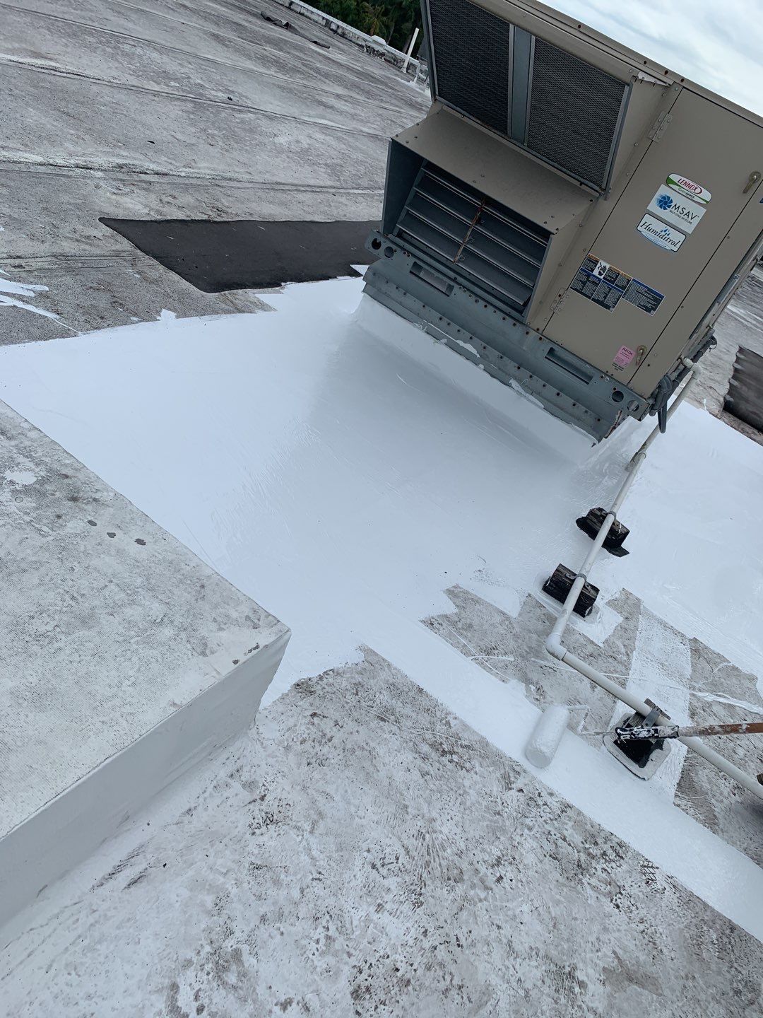 Roof repairs in progress on commercial flat roof in Hallandale Beach FL