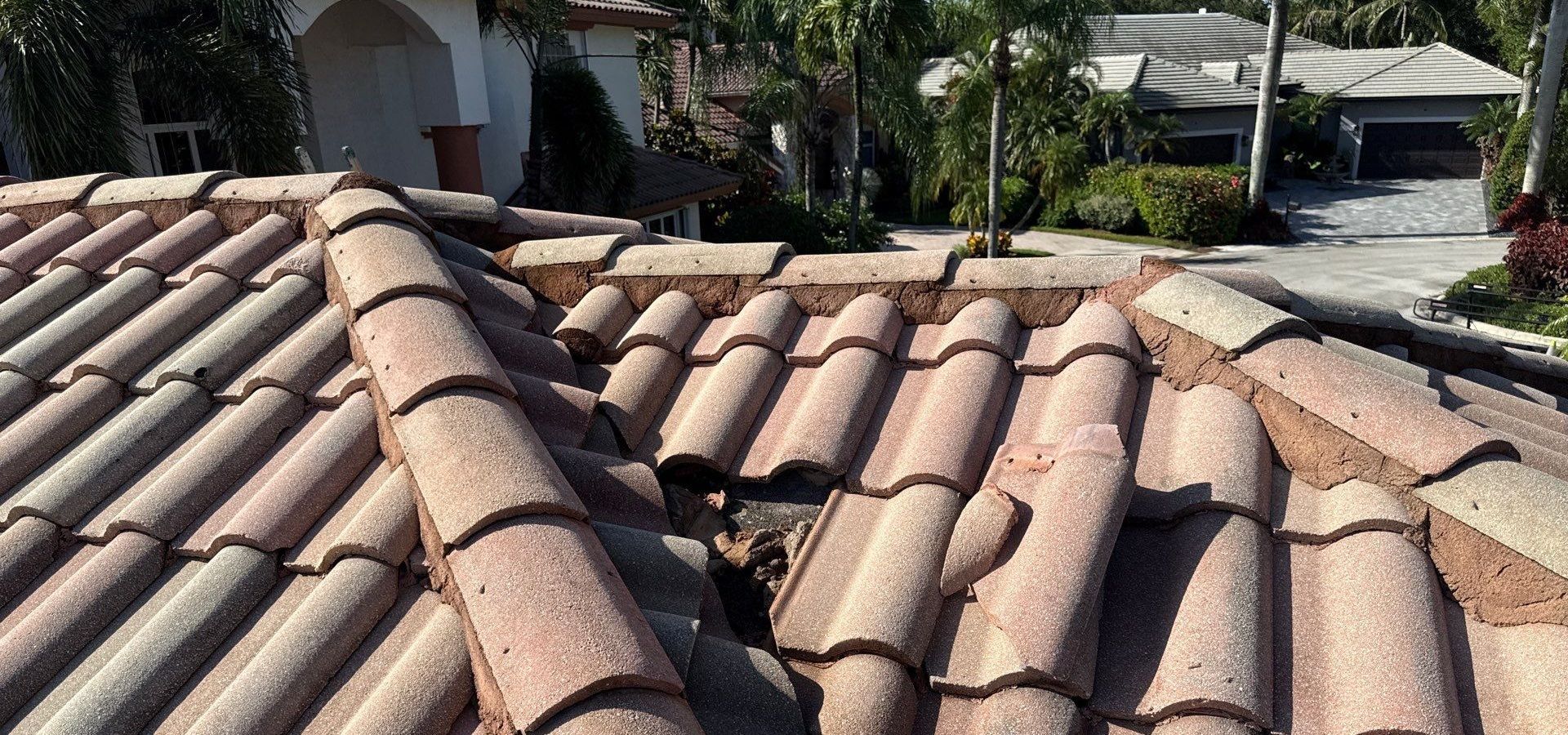Closeup of tile roof in Plantation FL showing damage needing roof repair