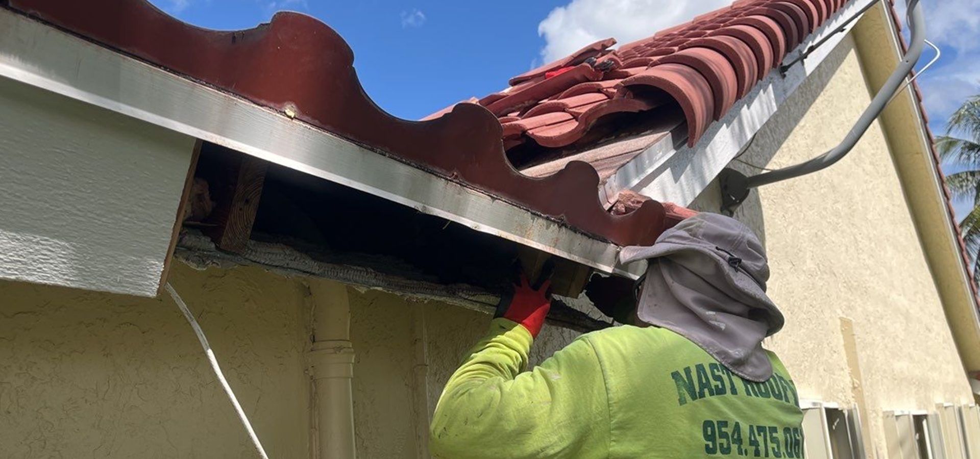 Nast roofing expert working on roof maintenance at a home in Plantation