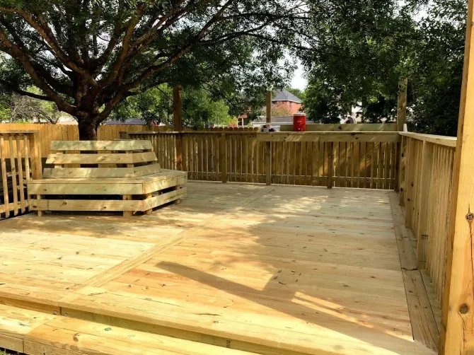 Wooden deck with built-in bench.