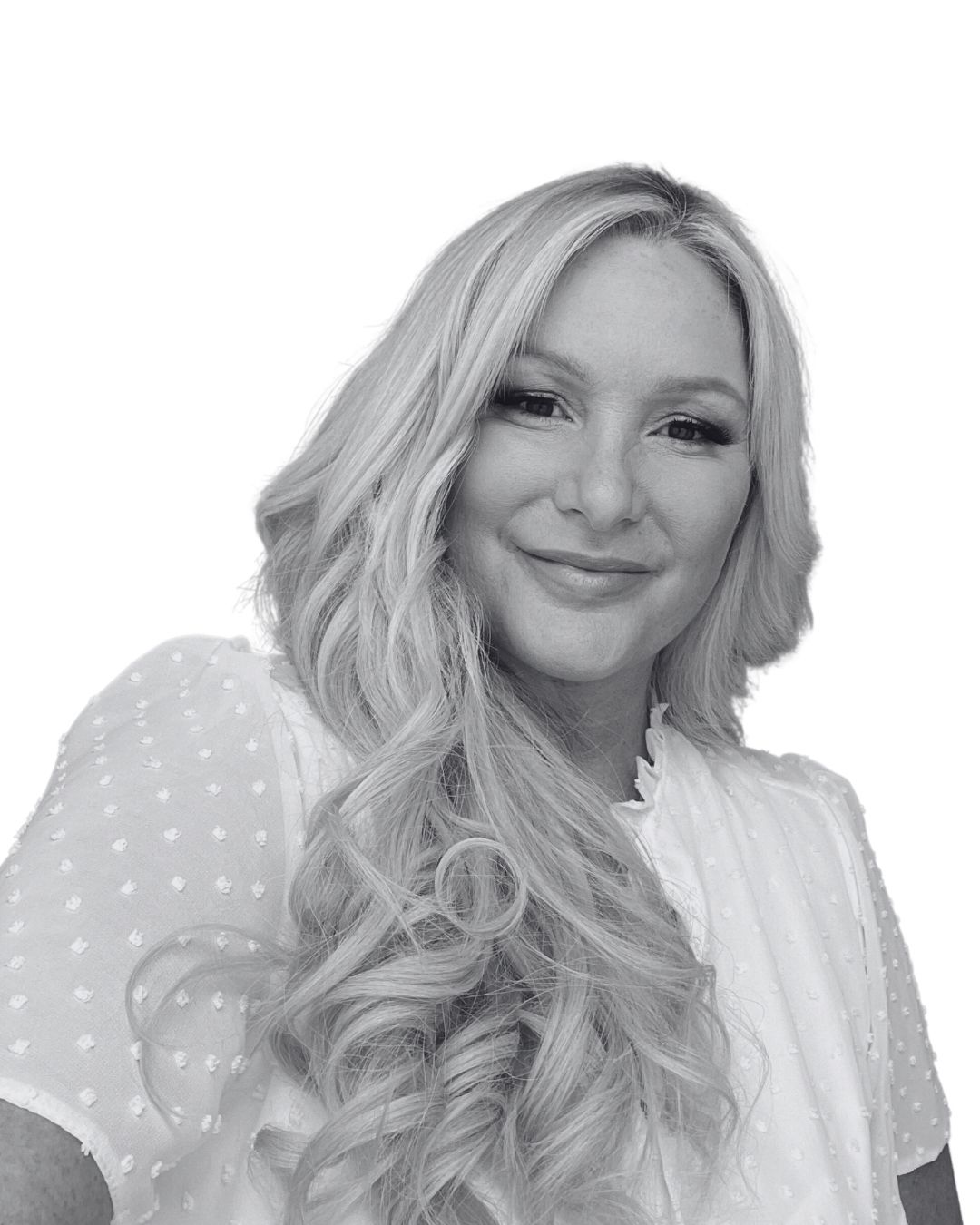 Blonde woman smiling, shoulder-up view, long wavy hair, white blouse.