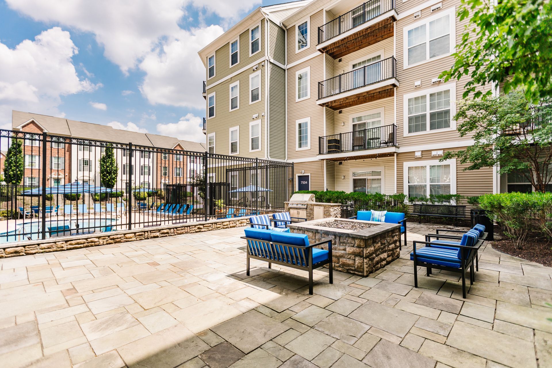 Outdoor courtyard and pool area at Verde at Howard Square West Apartments in Elkridge, MD.