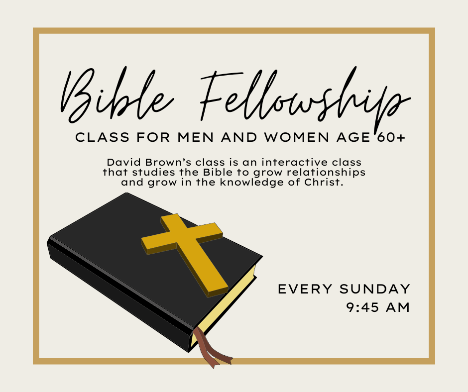 A black bible with a gold cross on it.