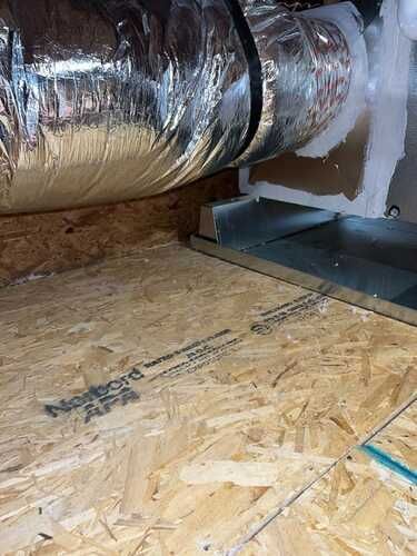 A close up of a duct on a wooden floor.