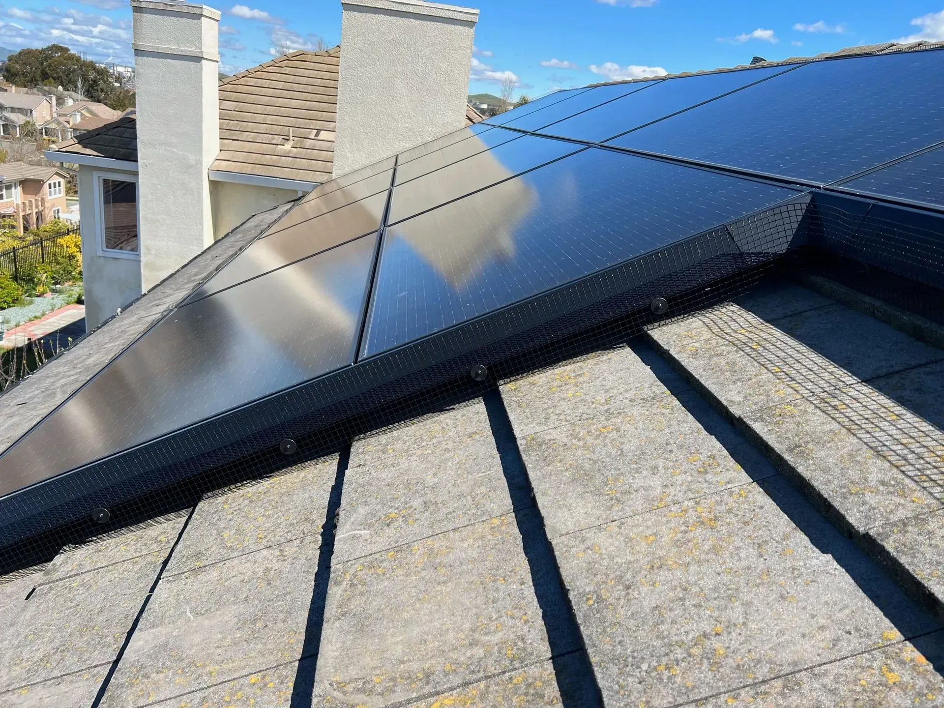 A roof with a lot of solar panels on it