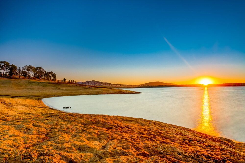 Picturesque Sunrise Overlooking a Lake in Albury — Border Security Doors & Powder Coating in Wodonga, VIC