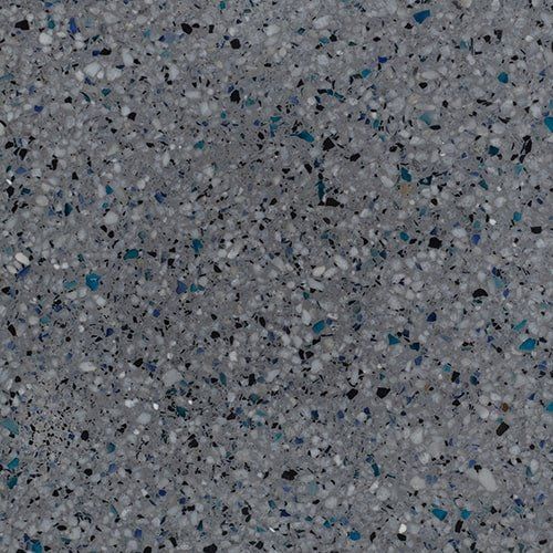 A close up of a gray and blue granite counter top.
