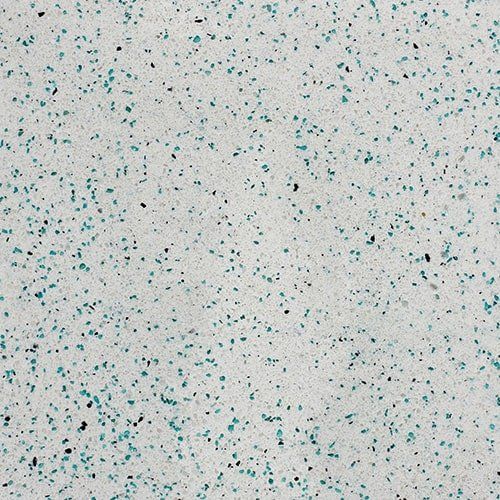 A close up of a white surface with blue dots on it