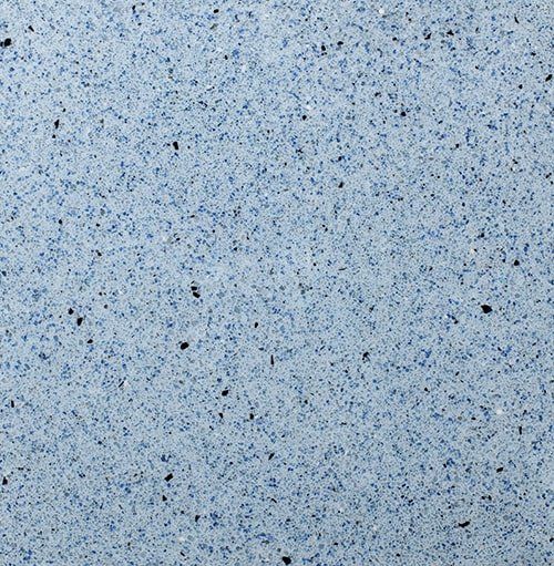 A close up of a blue and white granite counter top.