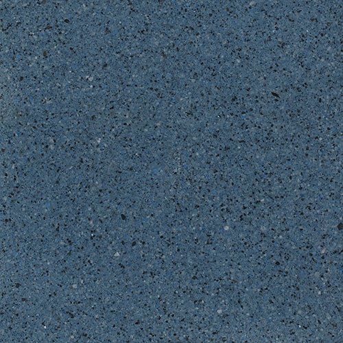 A close up of a blue granite counter top.