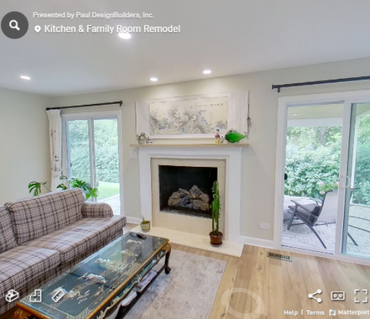 A living room with a fireplace and a couch