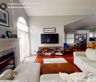 A living room with a flat screen tv on the wall