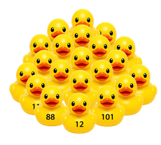 Pyramid of yellow rubber ducks, some with numbers printed on them.