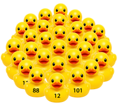 Cluster of yellow rubber ducks, some with numbers, arranged in a pyramid-like group on a white background