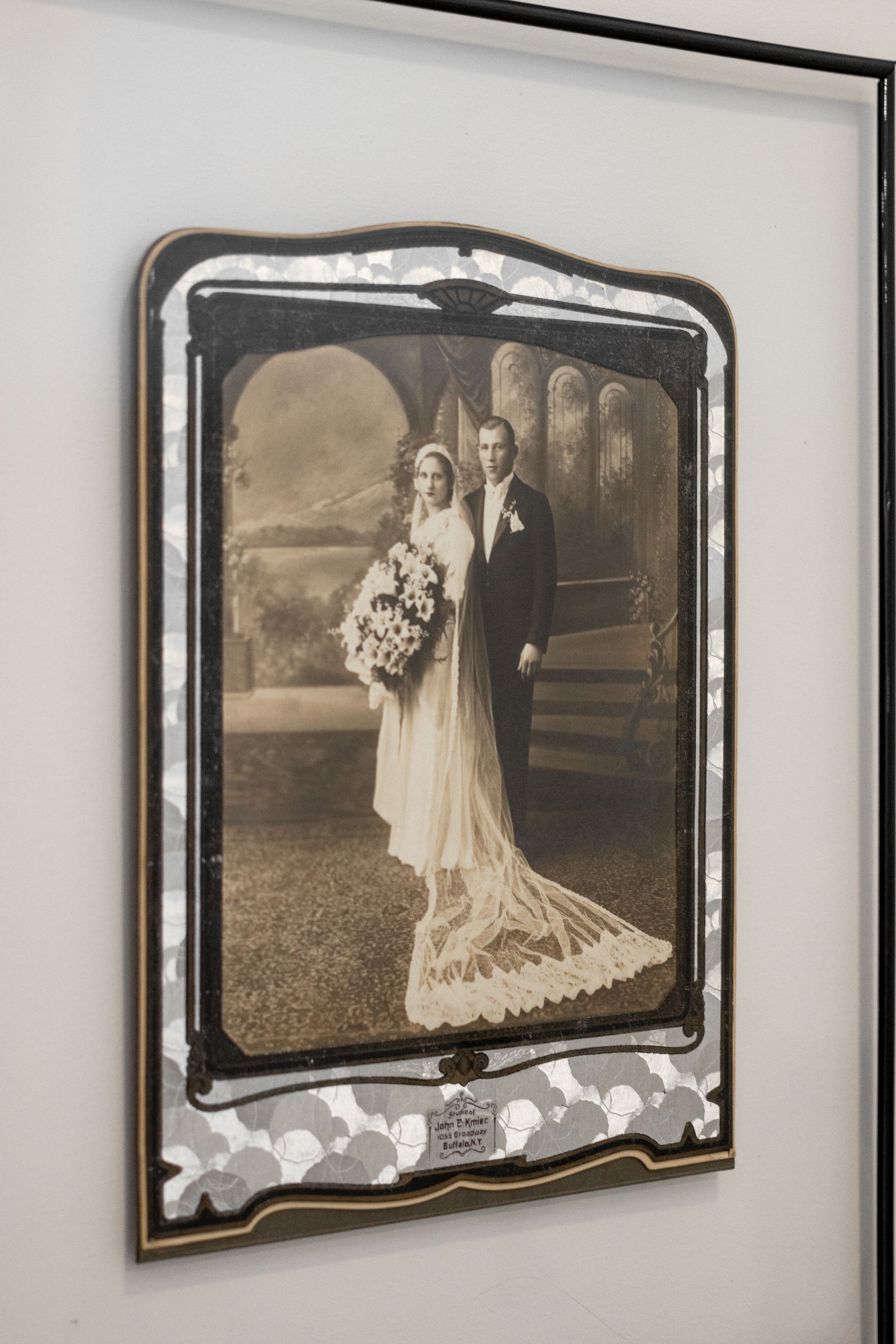 Framed vintage wedding portrait with a bride and groom in sepia tones
