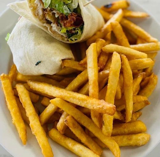 Wrap and French fries on a plate