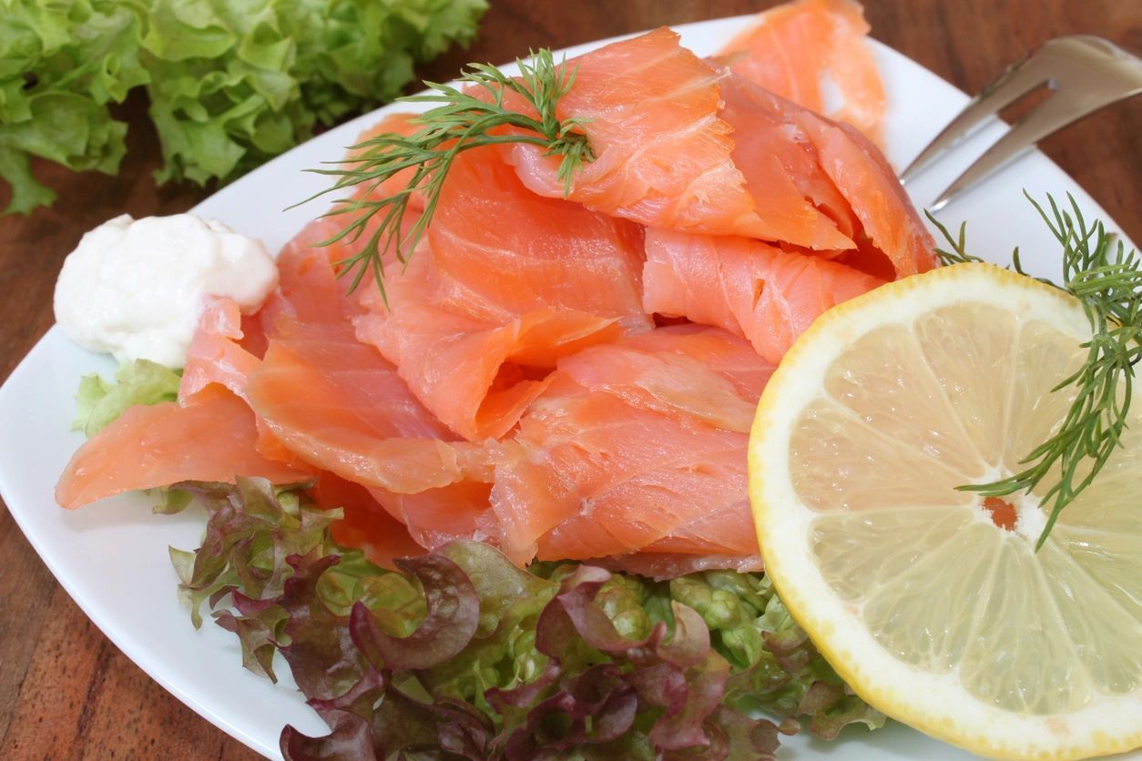 A White Plate Topped With Sliced Salmon And A Slice Of Lemon - Northfield, IL - Be40Strong A White Plate Topped With Sliced Salmon And A Slice Of Lemon - Northfield, IL - Be40Strong
