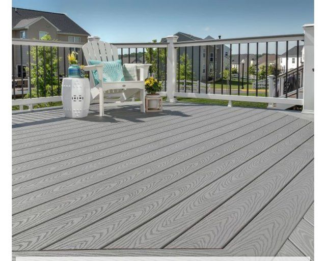A deck with a chair and a table on it