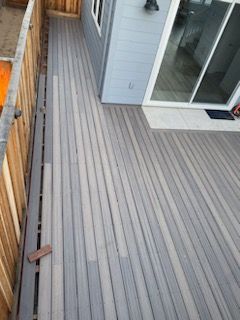 An aerial view of a wooden deck next to a house.