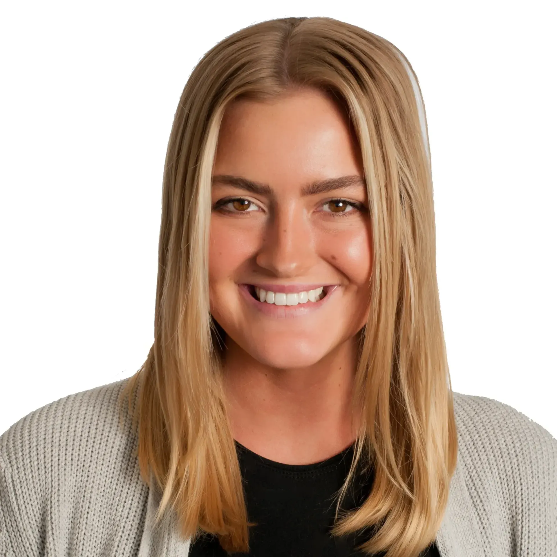 A woman with long blonde hair is smiling and wearing a grey sweater