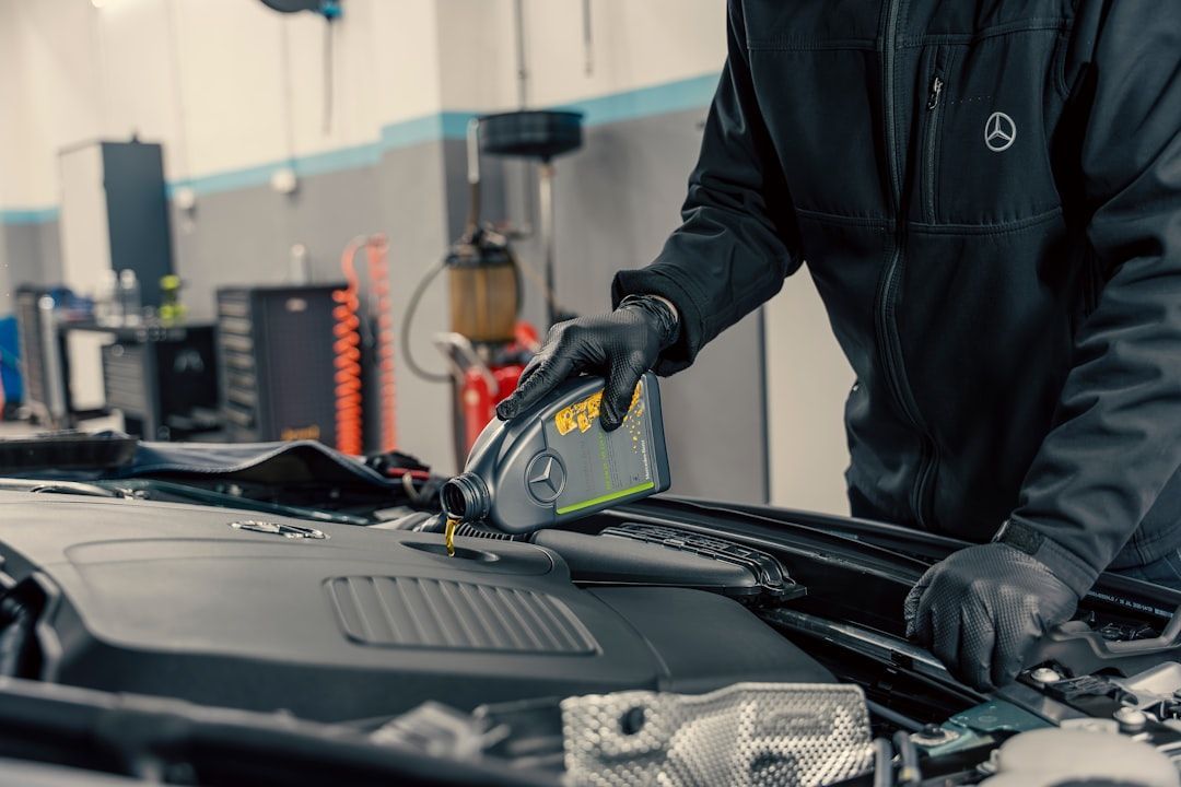 Auto repair marketing ideas featuring a mechanic servicing a car.