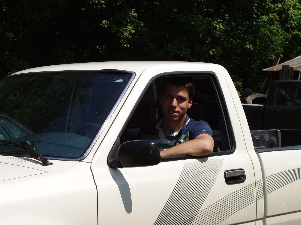 Automotive loyalty program featuring a customer in a pickup truck.
