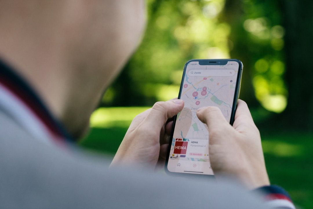 Person using a smartphone map to increase Google Business Profile traffic
