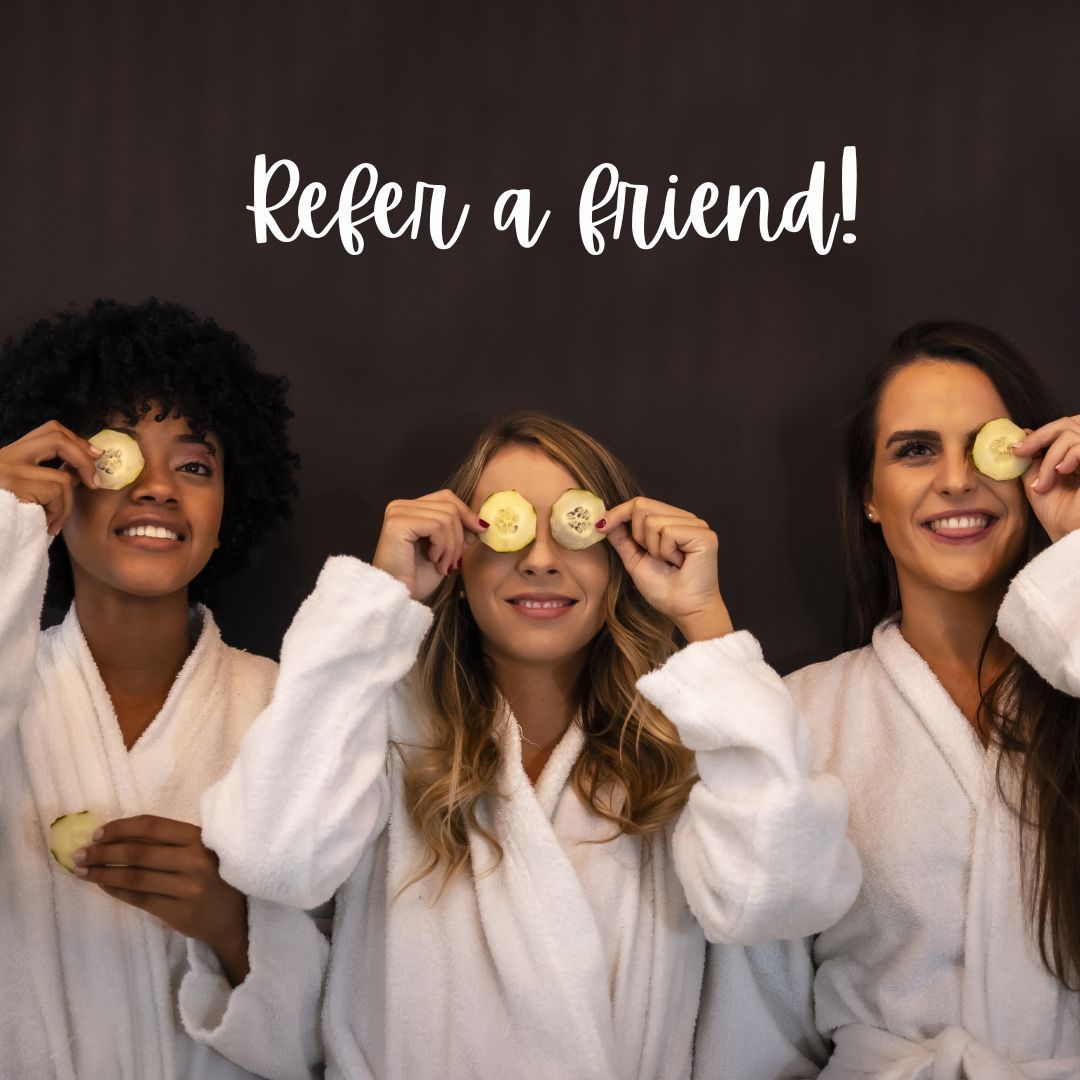 “Refer a friend” promo with three people in white robes holding cucumber slices over their eyes.