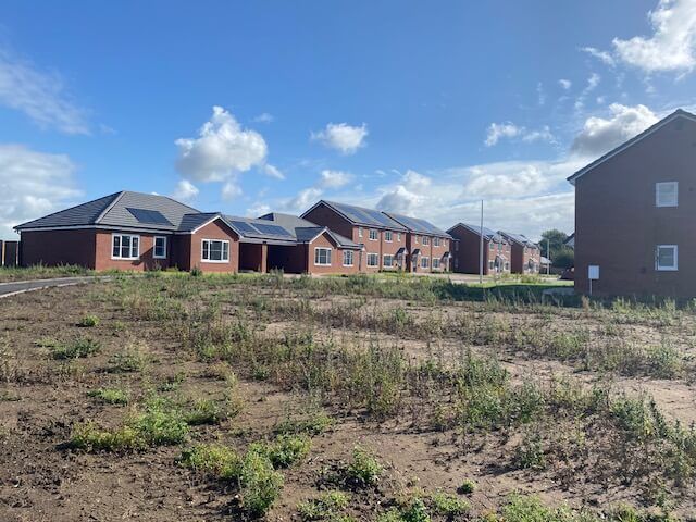 A row of new build houses, including Solar PV installation.