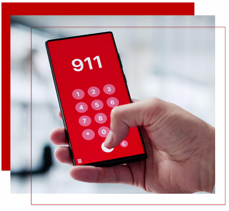 Hand holding a smartphone with a red 911 emergency dial screen