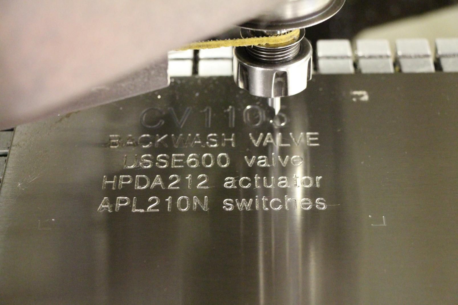 A Close Up of a Machine That Says 'Backwash Valve' on It — Total Engraving In Sandgate, NSW