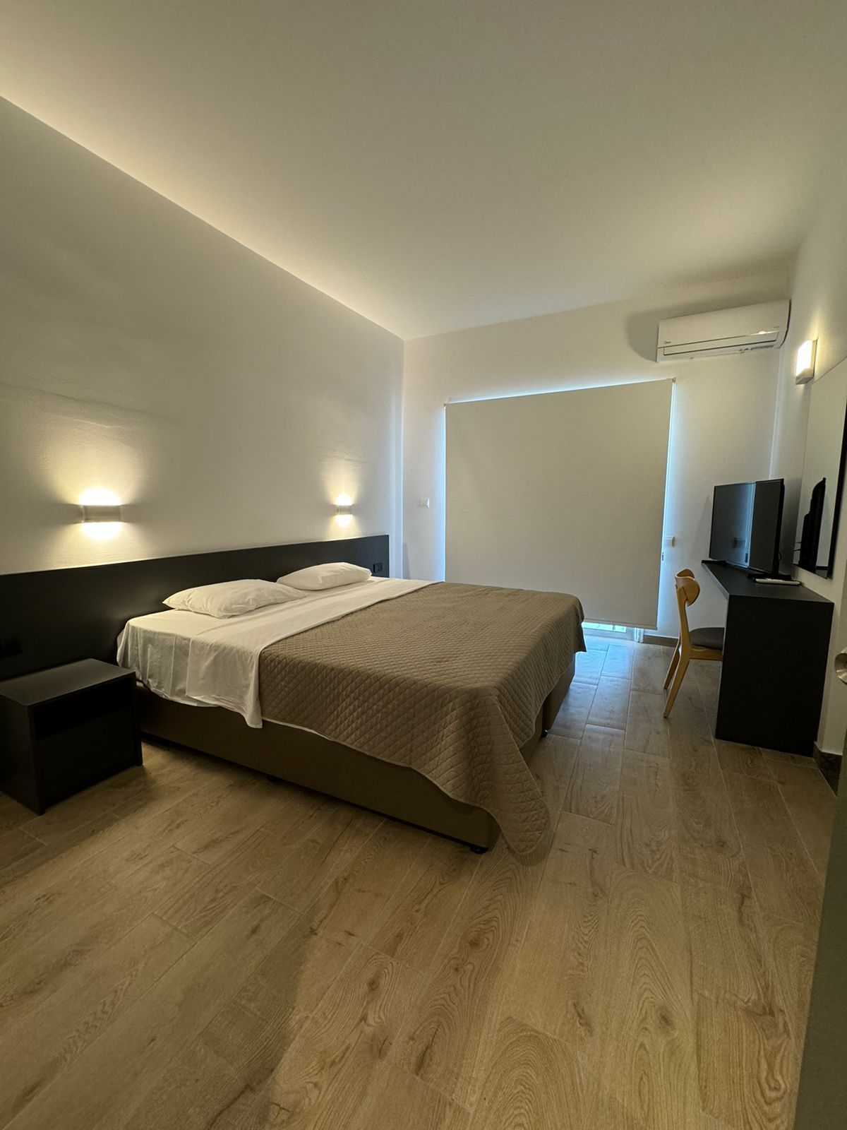 There is a large bed in the middle of the room.